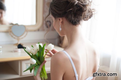 Stock Photo: Lace white wedding dress with long sleeves