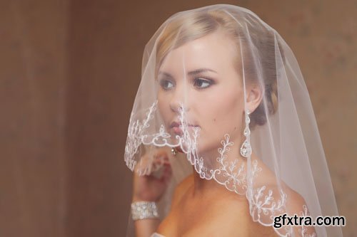 Stock Photo: Lace white wedding dress with long sleeves