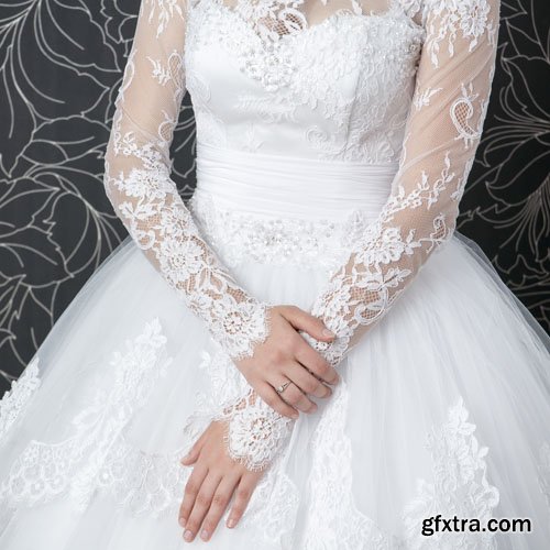 Stock Photo: Lace white wedding dress with long sleeves