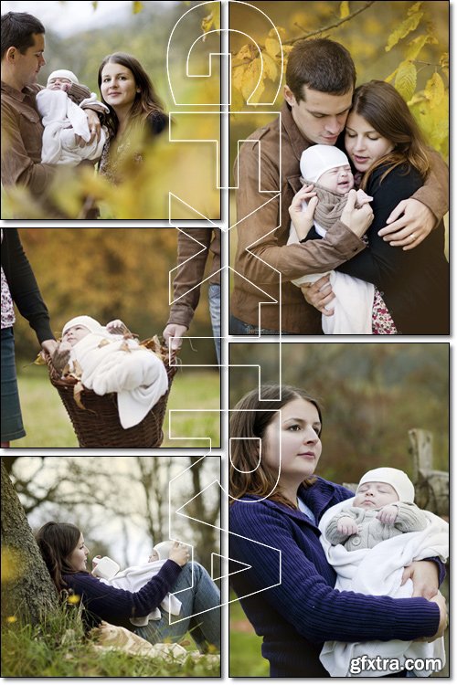 Happy young family with a newborn baby walking in the autumn park - Stock photo