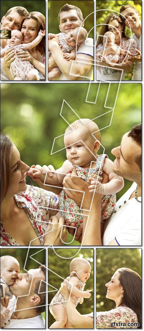 Happy parents with baby in park - Stock photo