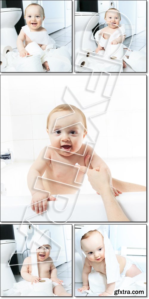 Toddler ripping up toilet paper in bathroom, after bath - Stock photo